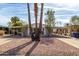 Low angle of home with palm trees and desert landscaping at 7645 E Gale Ave, Mesa, AZ 85209