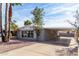 Residential building with covered parking, rock landscaping and palm trees at 7645 E Gale Ave, Mesa, AZ 85209