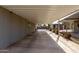 Attached carport offering ample parking space with desert landscaping at 7645 E Gale Ave, Mesa, AZ 85209