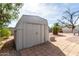 Durable storage shed in the backyard with easy access and ample space at 7645 E Gale Ave, Mesa, AZ 85209