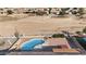 Enjoy this aerial view of the inground pool and landscaped backyard in a residential community at 801 S 120Th Ave, Avondale, AZ 85323