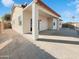 An expansive back patio is perfect for entertaining or relaxing outside this home at 801 S 120Th Ave, Avondale, AZ 85323