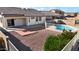 This desert landscaped backyard features a patio area with an inground swimming pool at 801 S 120Th Ave, Avondale, AZ 85323