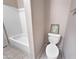 Bathroom featuring a toilet and bathtub with a framed picture at 801 S 120Th Ave, Avondale, AZ 85323