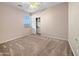 Bedroom featuring carpet flooring, light colored walls, a window, and a closet at 801 S 120Th Ave, Avondale, AZ 85323