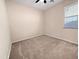 Bedroom featuring carpet flooring, light colored walls, and a window at 801 S 120Th Ave, Avondale, AZ 85323