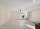 Bright living area with tile floors, a sliding glass door to the patio, and a ceiling fan at 801 S 120Th Ave, Avondale, AZ 85323