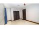 Bedroom featuring hardwood floors, neutral paint, a closet, and a ceiling fan at 824 W Luke Ave, Phoenix, AZ 85013