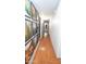 Long hallway with wood floors and stylishly decorated walls at 824 W Luke Ave, Phoenix, AZ 85013