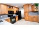 Renovated kitchen featuring granite countertops, a gas range and ample cabinet space at 824 W Luke Ave, Phoenix, AZ 85013