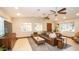 Comfortable living room showcasing a leather sectional, area rug, and natural lighting at 824 W Luke Ave, Phoenix, AZ 85013