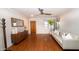 Bright living room features hardwood floors, modern furnishings, and a stylish ceiling fan at 824 W Luke Ave, Phoenix, AZ 85013