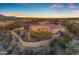 Aerial shot of backyard featuring pool, outdoor living space, and expansive desert views at 8320 E Arroyo Hondo Rd, Scottsdale, AZ 85266