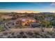 Luxury home with backyard oasis, showcasing mountain views and desert landscaping at 8320 E Arroyo Hondo Rd, Scottsdale, AZ 85266