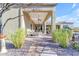 Covered patio overlooking backyard with view of landscaped desert terrain at 8320 E Arroyo Hondo Rd, Scottsdale, AZ 85266