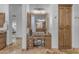 Bathroom featuring a vanity with granite countertop, storage cabinets, and tile flooring at 8320 E Arroyo Hondo Rd, Scottsdale, AZ 85266