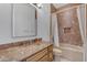 Bathroom featuring a marble vanity, toilet and tub with tile backsplash and a shower curtain at 8320 E Arroyo Hondo Rd, Scottsdale, AZ 85266