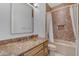 Bathroom featuring granite countertop vanity, sink, toilet, and shower-tub combo at 8320 E Arroyo Hondo Rd, Scottsdale, AZ 85266