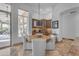 Cozy breakfast nook with built-in cabinets, a round table, and views of the outdoors at 8320 E Arroyo Hondo Rd, Scottsdale, AZ 85266