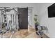 Spacious home gym with state-of-the-art weight training equipment and marble flooring at 8320 E Arroyo Hondo Rd, Scottsdale, AZ 85266