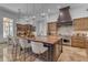 Gourmet kitchen boasting a spacious island with seating and luxurious marble countertops at 8320 E Arroyo Hondo Rd, Scottsdale, AZ 85266