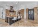 Chef's kitchen with a central island, wine cooler, and plenty of storage at 8320 E Arroyo Hondo Rd, Scottsdale, AZ 85266
