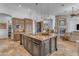 Well-appointed kitchen with a large center island, granite countertops, and a cozy fireplace view at 8320 E Arroyo Hondo Rd, Scottsdale, AZ 85266