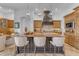 Beautiful kitchen with a large island, pendant lighting, and custom cabinetry at 8320 E Arroyo Hondo Rd, Scottsdale, AZ 85266