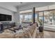 Living room with a large window offering views of the outdoor landscape at 8320 E Arroyo Hondo Rd, Scottsdale, AZ 85266