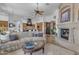 Spacious living room features a cozy fireplace and seamless access to the gourmet kitchen at 8320 E Arroyo Hondo Rd, Scottsdale, AZ 85266