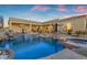 A backyard pool includes water features, spa and desert landscaping at 8320 E Arroyo Hondo Rd, Scottsdale, AZ 85266