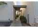 Exterior of the unit showcasing the walkway and greenery leading to the entrance for a welcoming appeal at 8558 E Indian School Rd # H, Scottsdale, AZ 85251