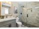 Modern bathroom featuring a glass-enclosed shower with gray tile and a stylish vanity at 8640 E Dianna Dr, Scottsdale, AZ 85254