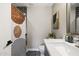 Bathroom boasting a modern shower with artistic curtain, sleek countertop, and stylish fixtures at 8640 E Dianna Dr, Scottsdale, AZ 85254