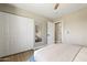 Cozy bedroom features a closet, arched mirror, and natural light at 8640 E Dianna Dr, Scottsdale, AZ 85254