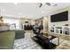 Bright, open living room with a modern design flowing into the kitchen, perfect for entertaining and Gathering time at 8640 E Dianna Dr, Scottsdale, AZ 85254