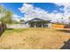 Expansive backyard with a covered patio, a white picket fence surrounding the pool, and mature landscaping at 9005 E Grandview Dr, Mesa, AZ 85207