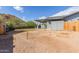 Open backyard space with a covered patio, and desert landscaping, great for relaxing under the sun at 9005 E Grandview Dr, Mesa, AZ 85207