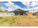 Large backyard featuring a covered patio, a white picket fence surrounding the pool, and mature landscaping at 9005 E Grandview Dr, Mesa, AZ 85207