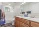 Bright bathroom with double sink vanity, large mirror, and tub/shower combination at 9005 E Grandview Dr, Mesa, AZ 85207