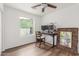 Bedroom with hardwood flooring, fan, and a desk for a cozy workspace at 9005 E Grandview Dr, Mesa, AZ 85207