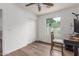 Bedroom features wood floors, natural light, and closet, creating a cozy atmosphere at 9005 E Grandview Dr, Mesa, AZ 85207