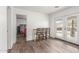 Bright dining area featuring french doors, wood-look flooring, and bar seating at 9005 E Grandview Dr, Mesa, AZ 85207