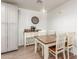 Dining area with a table, four chairs, and a console with coffee maker at 9005 E Grandview Dr, Mesa, AZ 85207