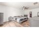 Spacious main bedroom with a ceiling fan, wood-look floors, and a walk-in closet at 9005 E Grandview Dr, Mesa, AZ 85207