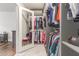 Well-organized walk-in closet with shelves and hanging rods for clothing storage at 9005 E Grandview Dr, Mesa, AZ 85207