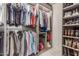 Organized walk-in closet with clothing racks and shelving for shoes and accessories at 9005 E Grandview Dr, Mesa, AZ 85207