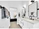 Elegant bathroom featuring dual sinks, modern fixtures, and a view to the main bedroom at 9739 E Pershing Ave, Scottsdale, AZ 85260