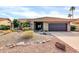 Charming single-story home featuring a desert-landscaped front yard, two car garage, and a stylish tile roof at 9739 E Pershing Ave, Scottsdale, AZ 85260