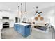 Spacious kitchen featuring a large center island, stainless steel appliances, and pendant lighting at 9739 E Pershing Ave, Scottsdale, AZ 85260